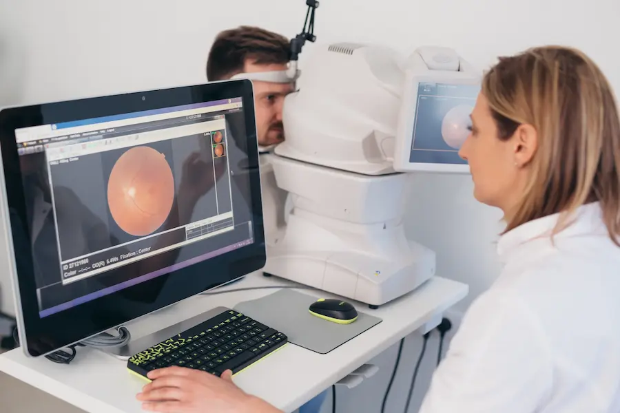 clinical-trial-retinal-imaging-screening-mobile Clinical research staff performing retinal imaging during a clinical trial screening visit
