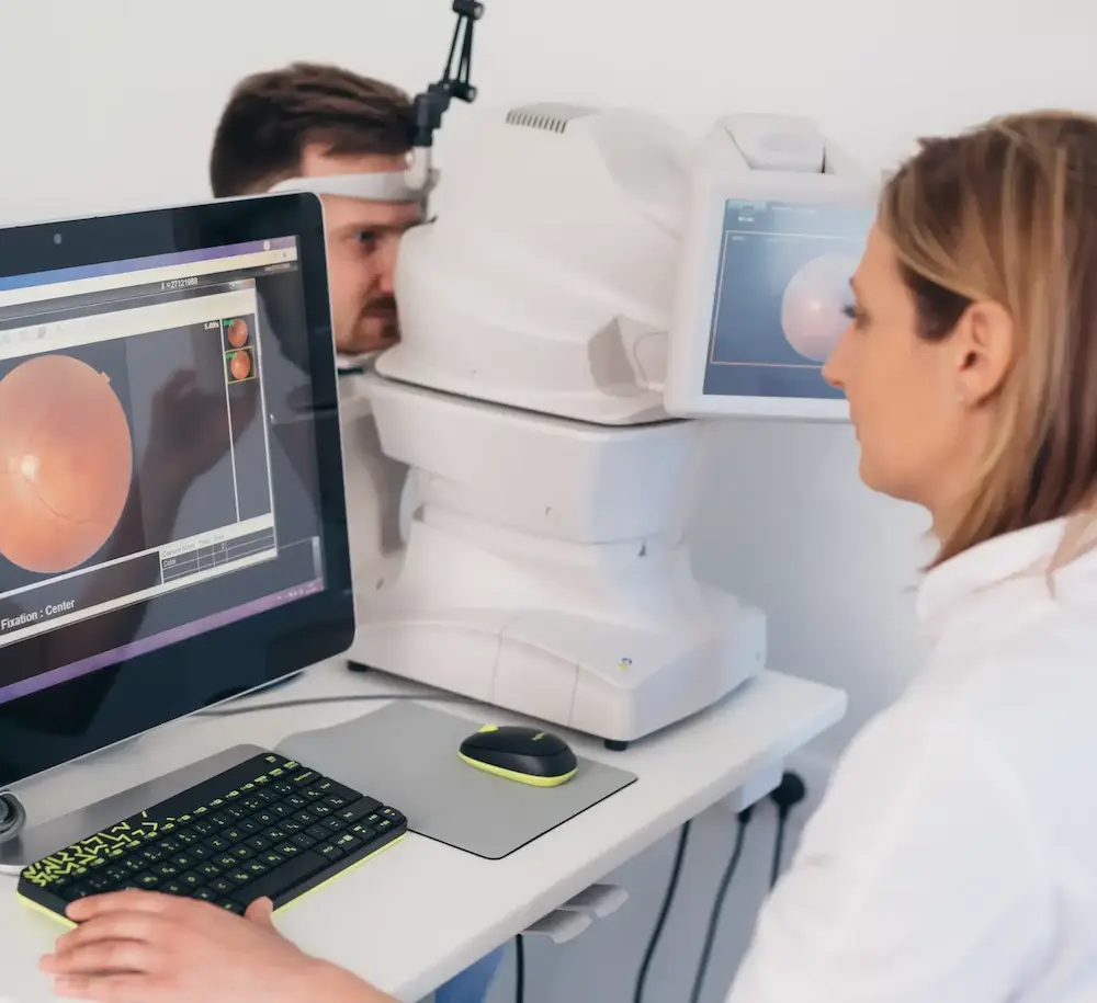 clinical-trial-retinal-imaging-screening-sq Clinical research staff performing retinal imaging during a clinical trial screening visit